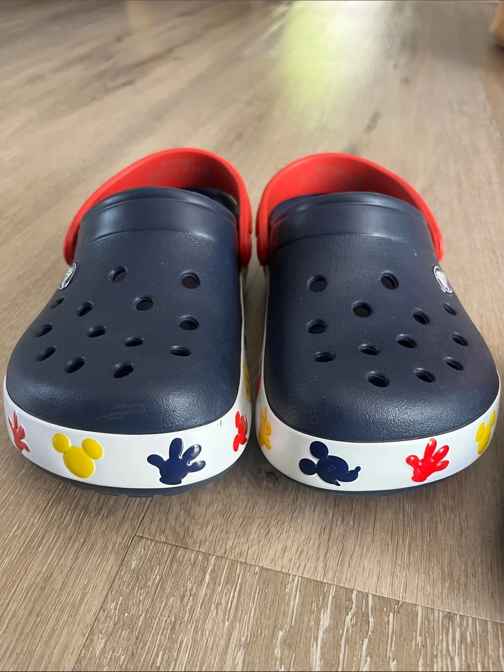 CROCS Kids Navy Clogs with Red Strap and Multicolor Floral Sole